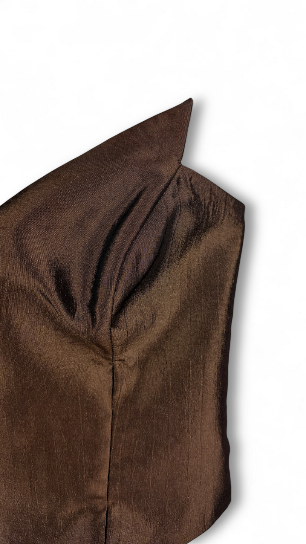 Close-up of metallic textured fabric in brown corset top