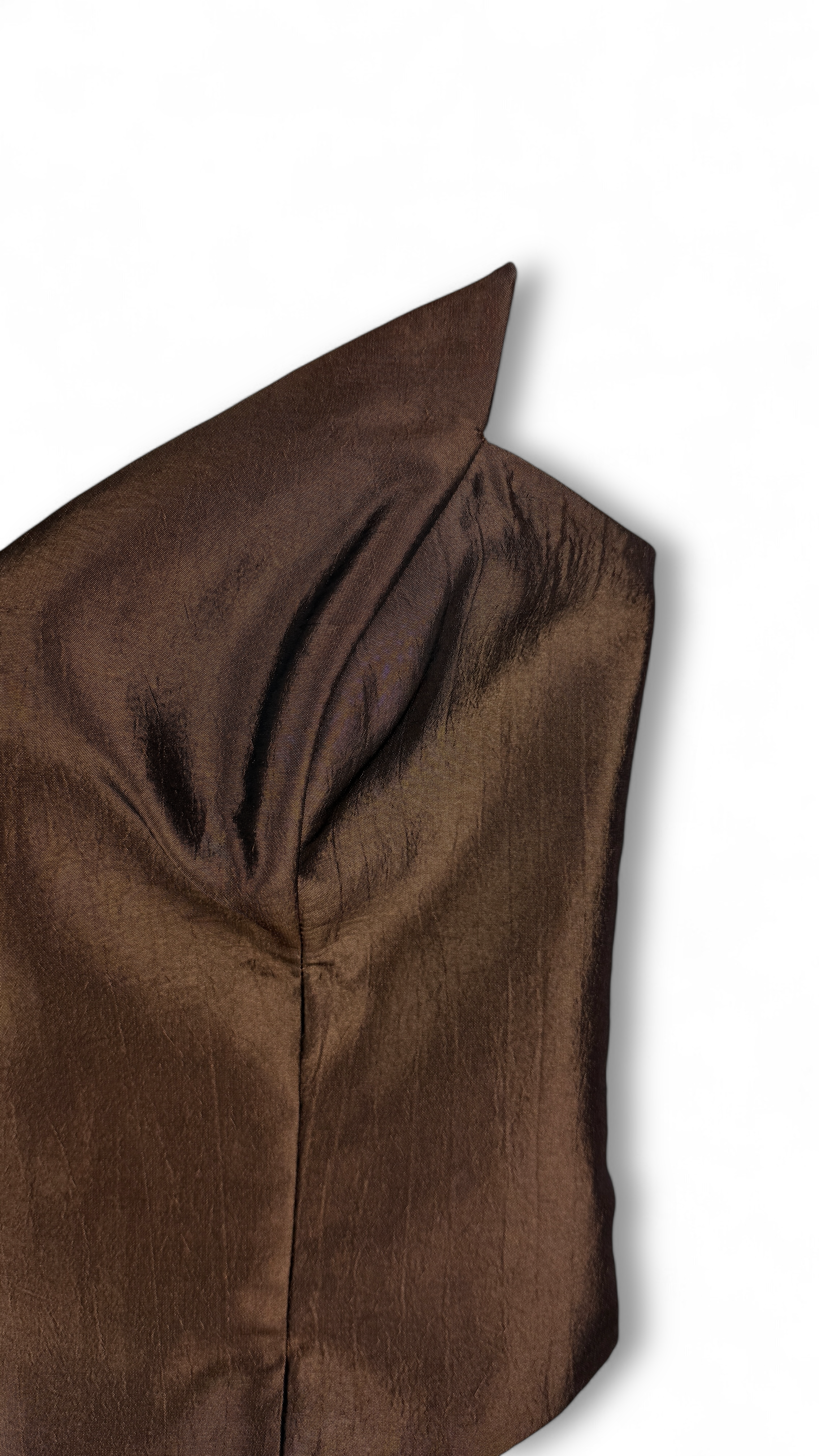 Close-up of metallic textured fabric in brown corset top
