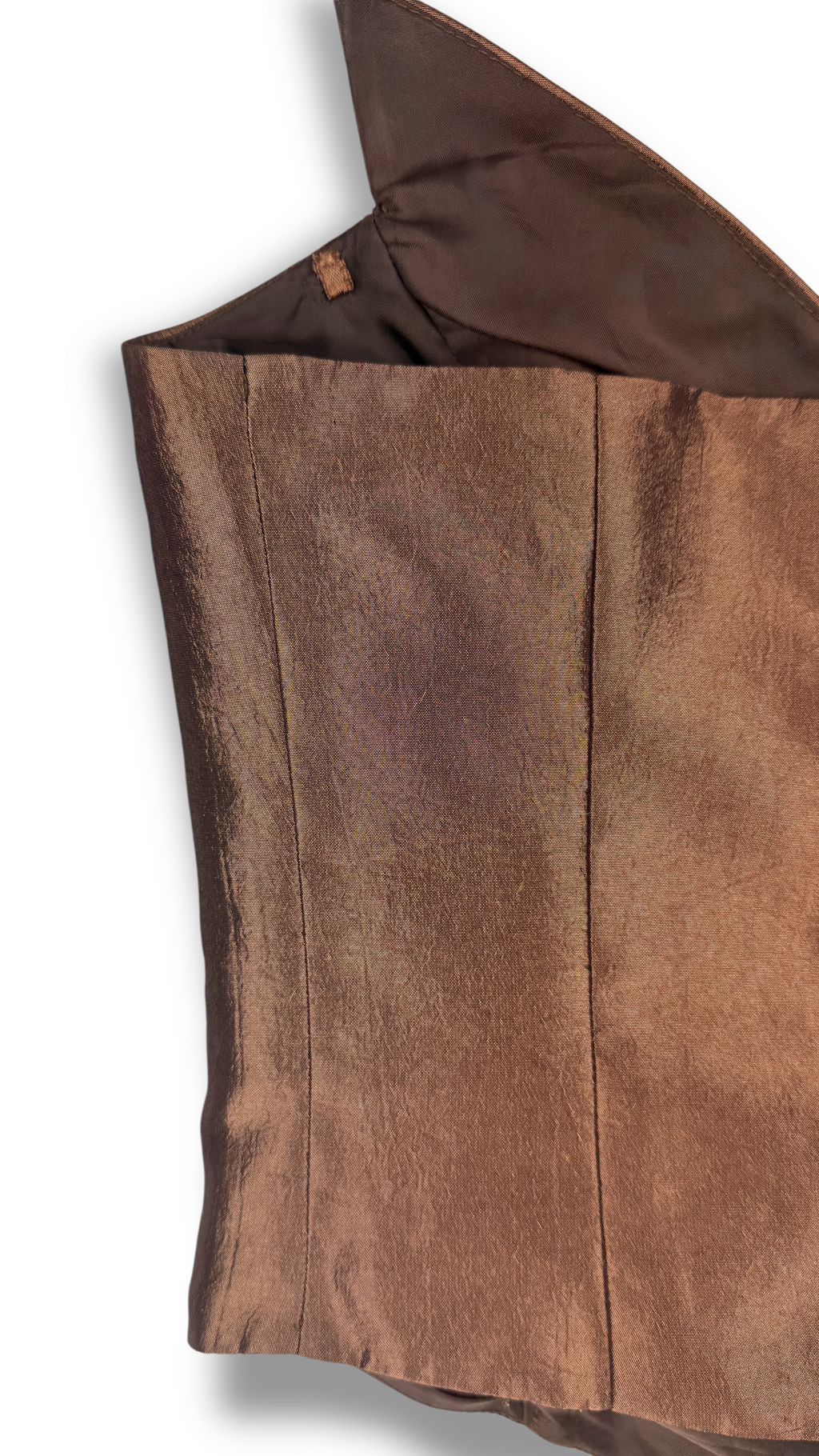Close-up of metallic textured fabric in brown corset top