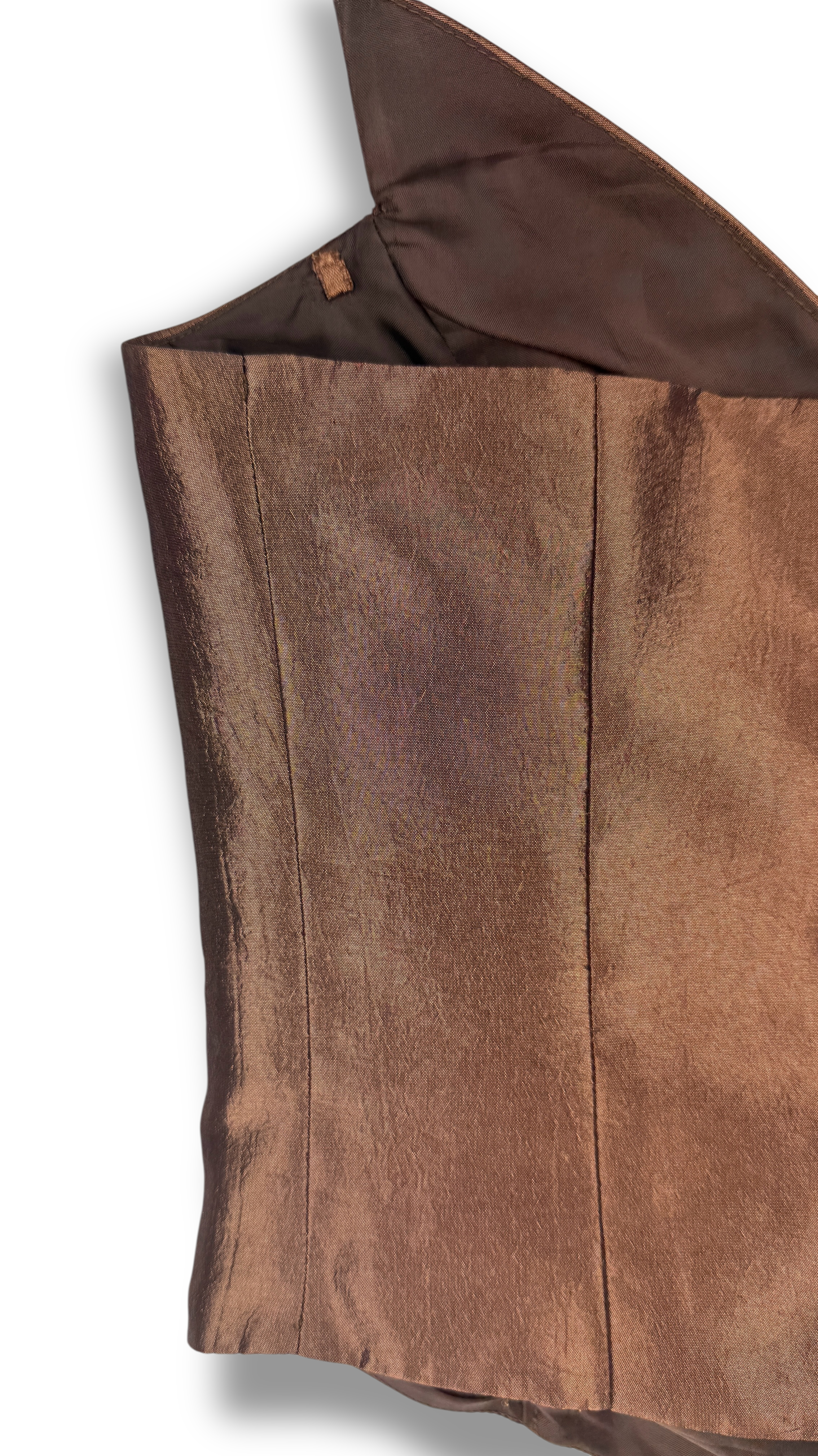 Close-up of metallic textured fabric in brown corset top